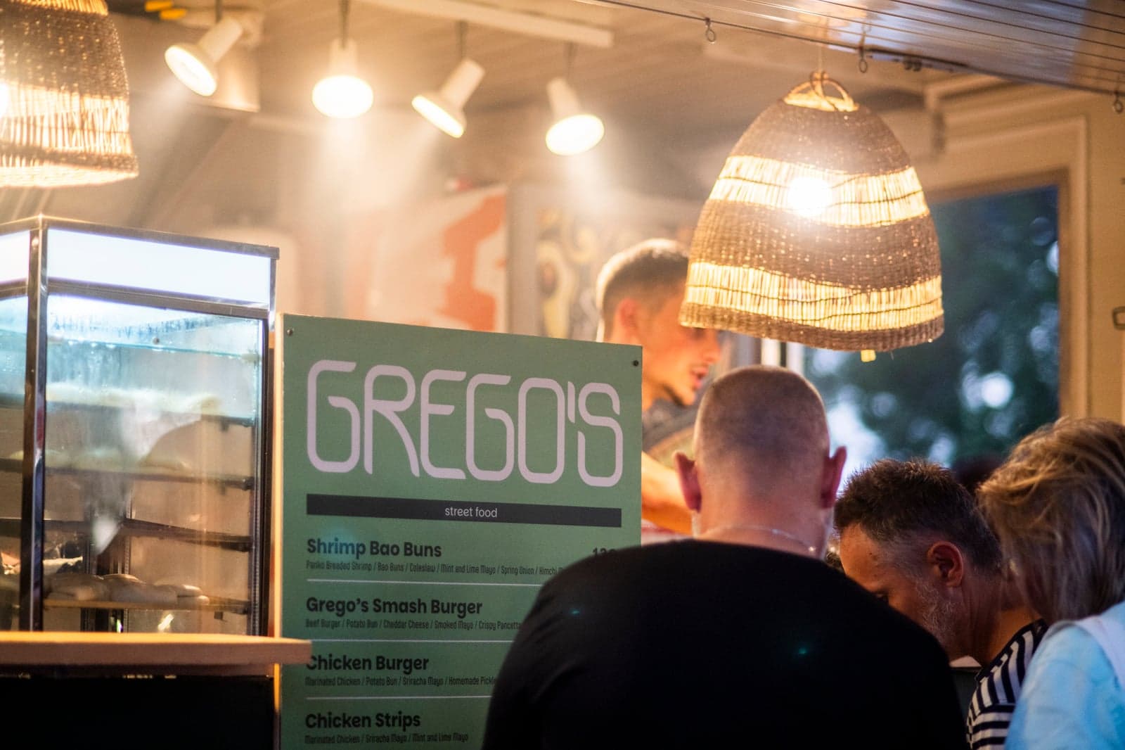 Customers ordering at Grego's food truck
